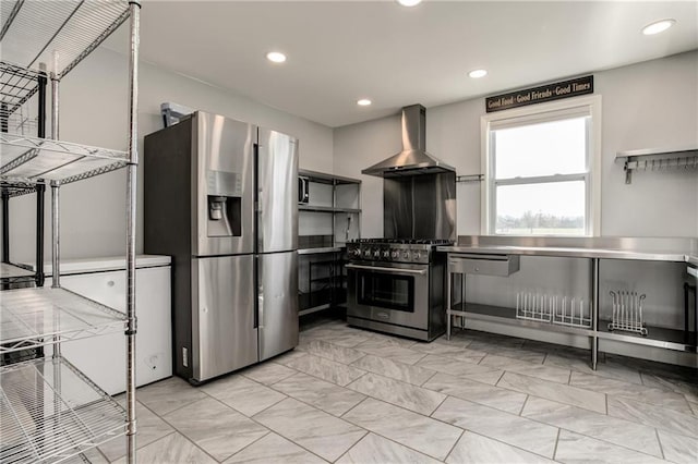 6721 S Read Rd Unit 1, Pleasanton, KS 66075 - kitchen featuring stainless steel countertops, stainless steel appliances, wall chimney range hood, recessed lighting, and open shelves