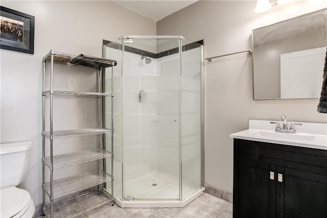 6721 S Read Rd Unit 1, Pleasanton, KS 66075 - bathroom featuring a shower stall, toilet, vanity, and tile patterned flooring