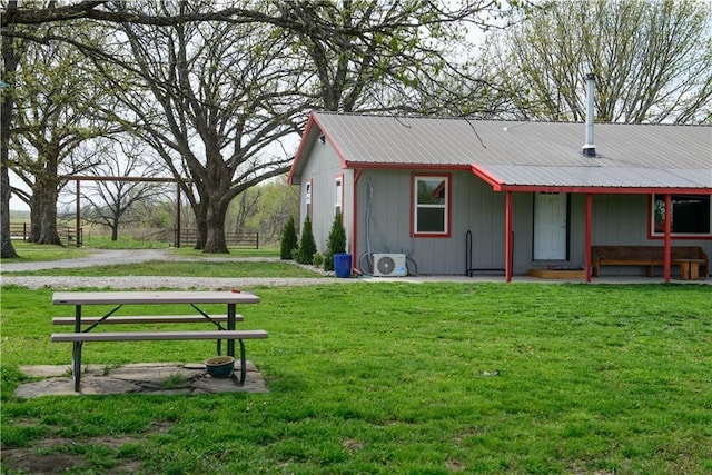 6721 S Read Rd Unit 1, Pleasanton, KS 66075 - back of house featuring metal roof and a cooling unit
