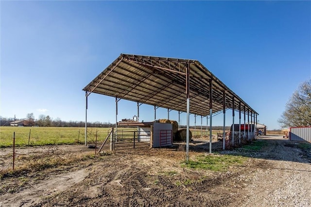6721 S Read Rd Unit 1, Pleasanton, KS 66075 - view of parking featuring a detached carport and a rural view