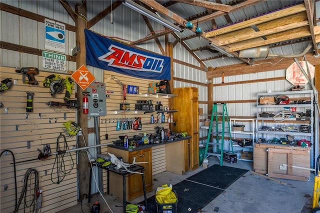 6721 S Read Rd Unit 1, Pleasanton, KS 66075 - garage featuring a workshop area and metal wall