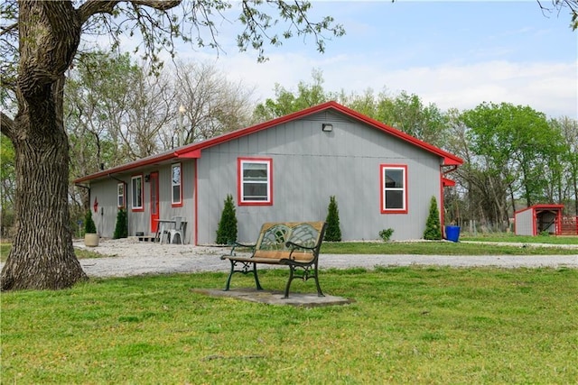 6721 S Read Rd Unit 1, Pleasanton, KS 66075 - rear view of house featuring a lawn