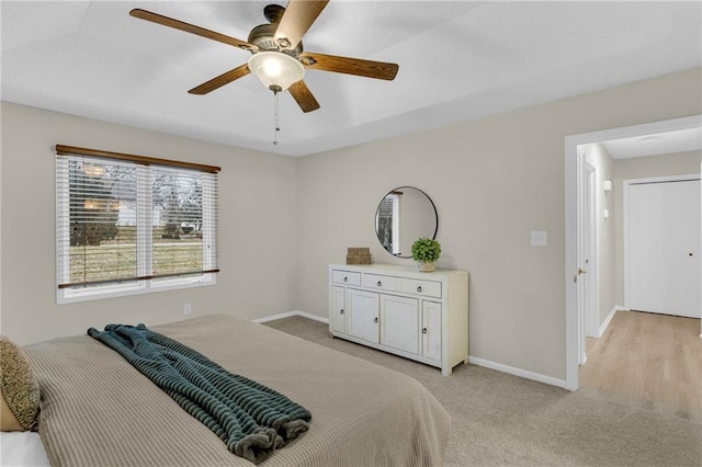 14 Woodbridge Ln, Kansas City, MO 64145 - bedroom with baseboards, light colored carpet, and a ceiling fan
