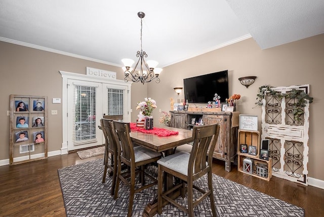 9500 Georgia Ave, Kansas City, KS 66109 - dining room featuring a chandelier, crown molding, baseboards, wood finished floors, and french doors