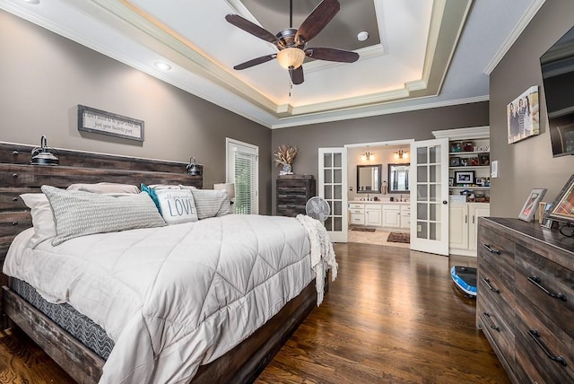 9500 Georgia Ave, Kansas City, KS 66109 - bedroom with french doors, a tray ceiling, ornamental molding, dark wood-style flooring, and connected bathroom
