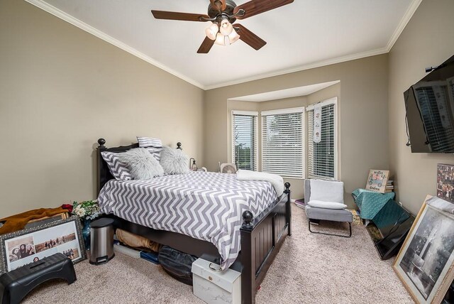 9500 Georgia Ave, Kansas City, KS 66109 - bedroom with carpet flooring, crown molding, and ceiling fan