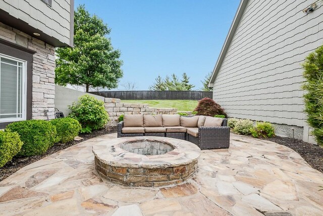 9500 Georgia Ave, Kansas City, KS 66109 - fenced backyard featuring a fire pit and a patio area