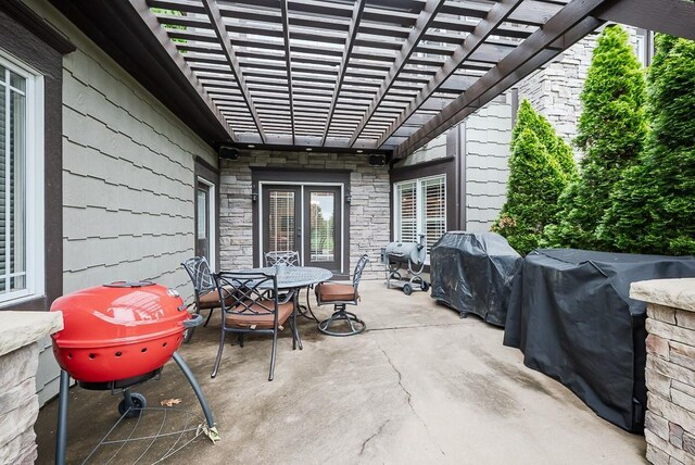 9500 Georgia Ave, Kansas City, KS 66109 - view of patio / terrace with outdoor dining space, a pergola, and area for grilling
