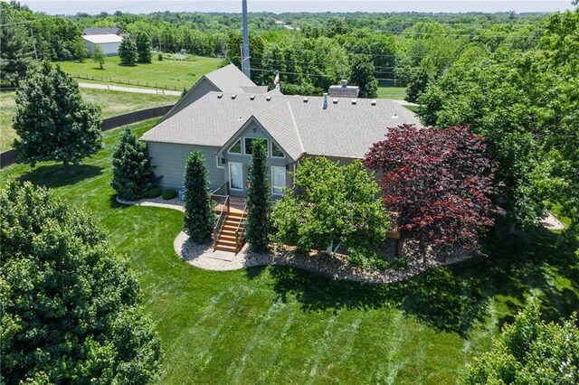 9500 Georgia Ave, Kansas City, KS 66109 - aerial view of property and surrounding area featuring a heavily wooded area