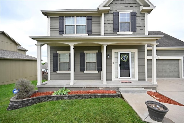 8941 NE 116th Pl, Kansas City, MO 64157 - view of front of home with covered porch, driveway, and a garage