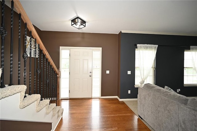 8941 NE 116th Pl, Kansas City, MO 64157 - entrance foyer with stairway, baseboards, wood finished floors, and crown molding