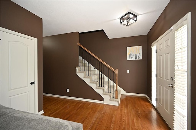 8941 NE 116th Pl, Kansas City, MO 64157 - entryway with wood finished floors, baseboards, and stairs