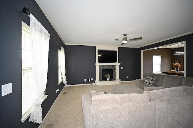 8941 NE 116th Pl, Kansas City, MO 64157 - living area with ornamental molding, carpet flooring, healthy amount of natural light, and a ceiling fan