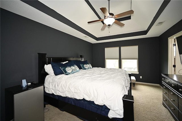 8941 NE 116th Pl, Kansas City, MO 64157 - carpeted bedroom with a raised ceiling, baseboards, and a ceiling fan