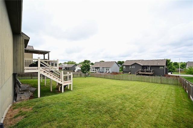 8941 NE 116th Pl, Kansas City, MO 64157 - view of yard featuring stairway, a residential view, and a wooden deck