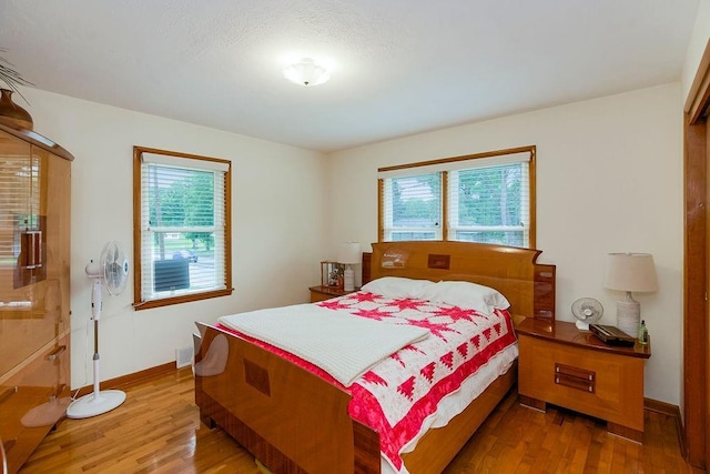 911 Limit St, Leavenworth, KS 66048 - bedroom featuring wood finished floors and baseboards