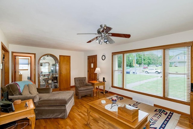 911 Limit St, Leavenworth, KS 66048 - living room featuring ceiling fan, baseboards, and light wood finished floors