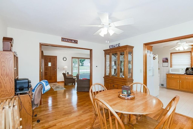 911 Limit St, Leavenworth, KS 66048 - dining space with ceiling fan and light wood finished floors