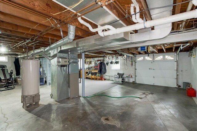 911 Limit St, Leavenworth, KS 66048 - garage featuring gas water heater and heating unit