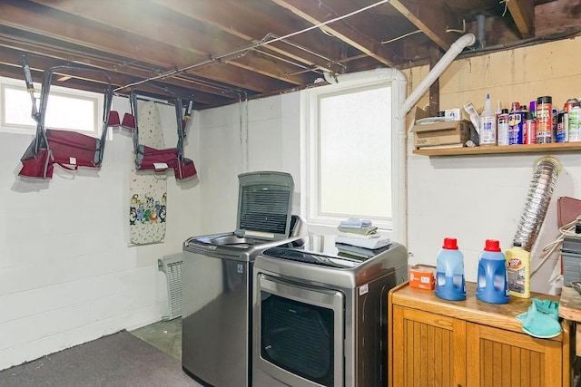911 Limit St, Leavenworth, KS 66048 - laundry area featuring healthy amount of natural light and independent washer and dryer