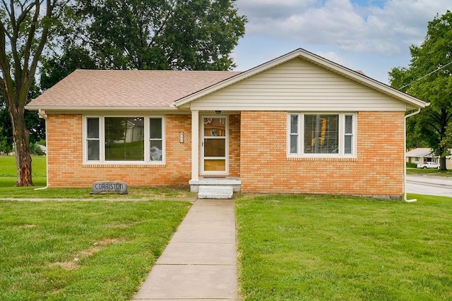911 Limit St, Leavenworth, KS 66048 - view of front of home with brick siding and a front lawn