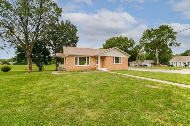 911 Limit St, Leavenworth, KS 66048 - ranch-style home with brick siding and a front yard