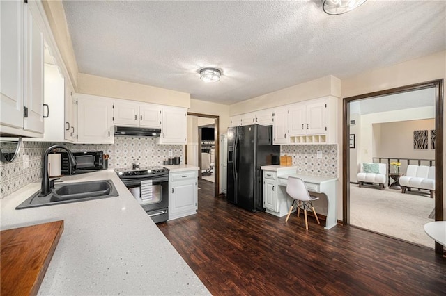 2018 Park Ln, Smithville, MO 64089 - kitchen with black appliances, under cabinet range hood, a sink, light countertops, and a textured ceiling