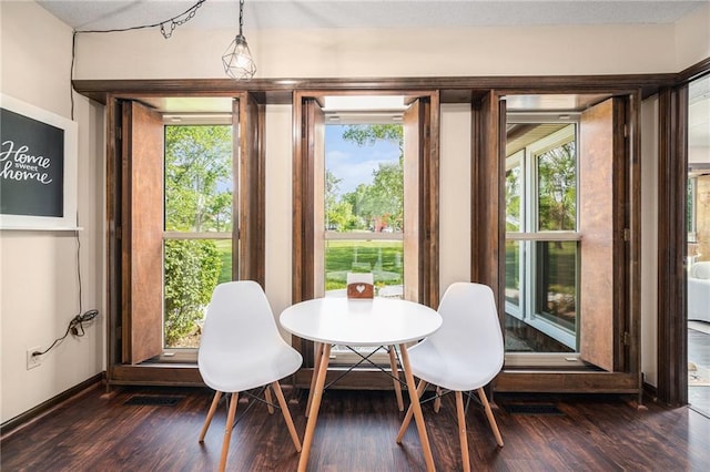 2018 Park Ln, Smithville, MO 64089 - dining room featuring dark wood-type flooring, plenty of natural light, and baseboards