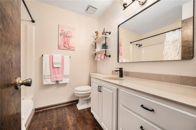 2018 Park Ln, Smithville, MO 64089 - full bath featuring toilet, wood finished floors, vanity, baseboards, and shower / bath combination with curtain