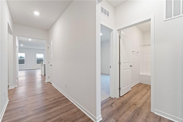 2114 Creek View Ln, Raymore, MO 64083 - hallway featuring wood finished floors, recessed lighting, and baseboards
