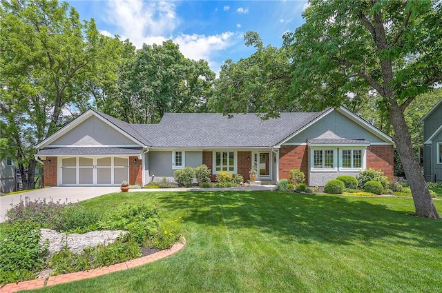 2400 W 162nd St, Stilwell, KS 66085 - ranch-style house with brick siding, an attached garage, concrete driveway, and a front lawn