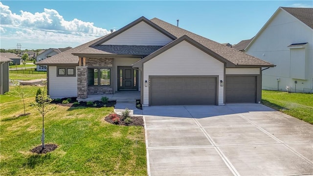 5854 Mccormick Dr, Shawnee, KS 66226 - view of front of house with driveway, an attached garage, a front lawn, and a shingled roof