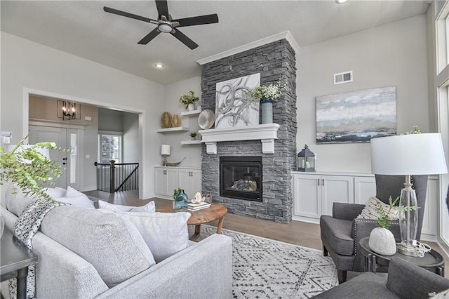 5854 Mccormick Dr, Shawnee, KS 66226 - living area featuring ceiling fan, wood finished floors, a fireplace, and recessed lighting