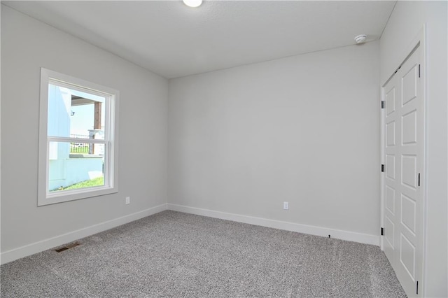 5854 Mccormick Dr, Shawnee, KS 66226 - empty room featuring carpet floors, baseboards, and a smoke detector