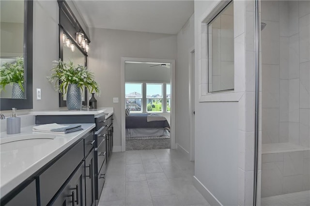 5854 Mccormick Dr, Shawnee, KS 66226 - full bathroom featuring baseboards, vanity, ensuite bath, tile patterned flooring, and a tile shower
