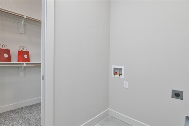 5854 Mccormick Dr, Shawnee, KS 66226 - laundry room featuring hookup for an electric dryer, baseboards, and washer hookup