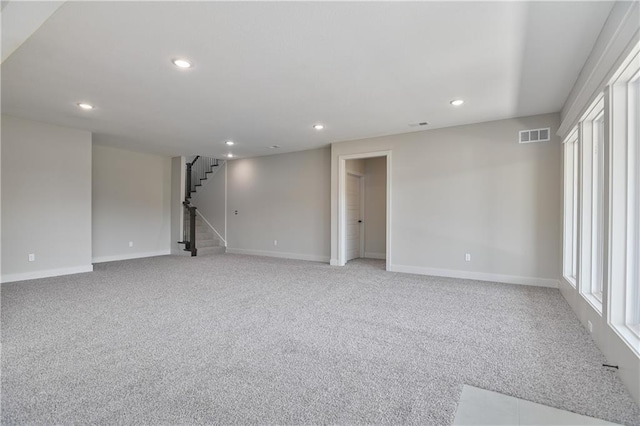 5854 Mccormick Dr, Shawnee, KS 66226 - unfurnished room featuring baseboards, light carpet, recessed lighting, and stairs