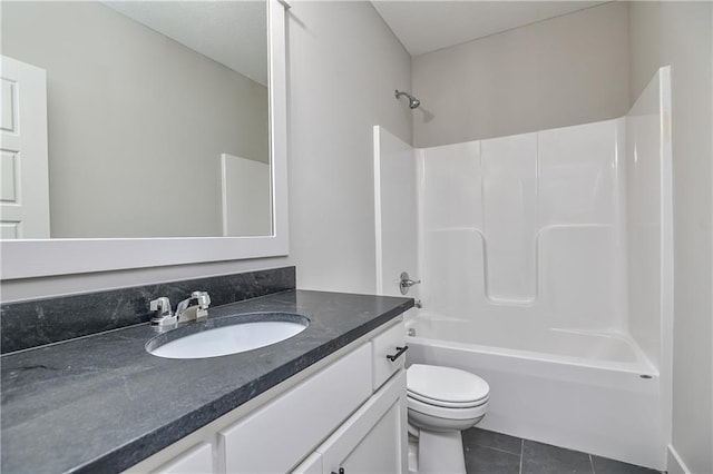 5854 Mccormick Dr, Shawnee, KS 66226 - bathroom featuring vanity, toilet, tile patterned flooring, and washtub / shower combination