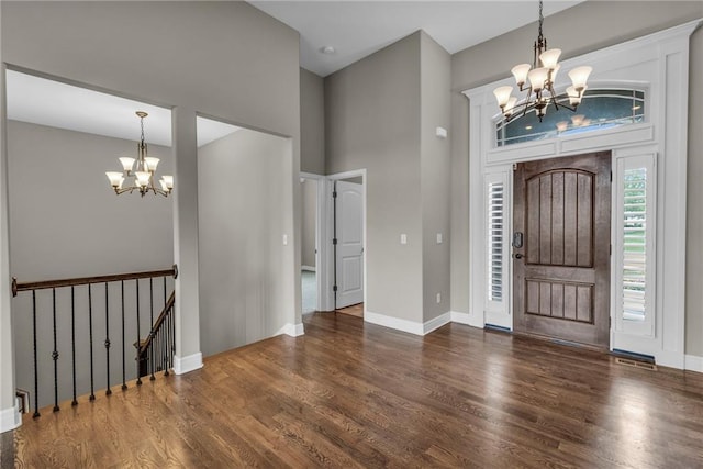 12750 N Arbor Way, Platte City, MO 64079 - entryway featuring a chandelier, wood finished floors, a towering ceiling, and baseboards