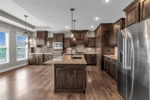 12750 N Arbor Way, Platte City, MO 64079 - kitchen with appliances with stainless steel finishes, a sink, dark brown cabinetry, dark wood-style floors, and backsplash