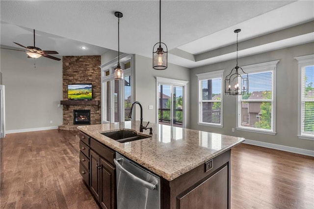 12750 N Arbor Way, Platte City, MO 64079 - kitchen with dishwasher, a sink, open floor plan, and dark wood-style floors