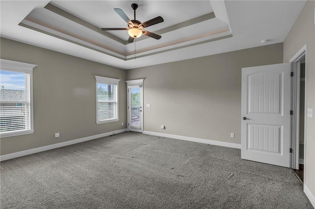 12750 N Arbor Way, Platte City, MO 64079 - carpeted spare room with a raised ceiling, ceiling fan, and baseboards