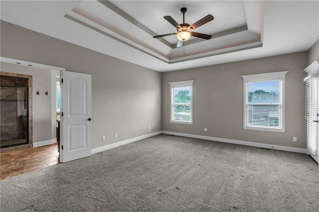 12750 N Arbor Way, Platte City, MO 64079 - unfurnished room featuring carpet flooring, ceiling fan, a raised ceiling, and baseboards