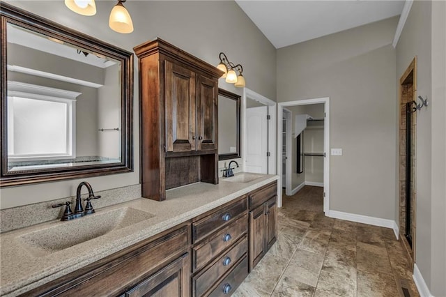 12750 N Arbor Way, Platte City, MO 64079 - bathroom featuring double vanity and baseboards