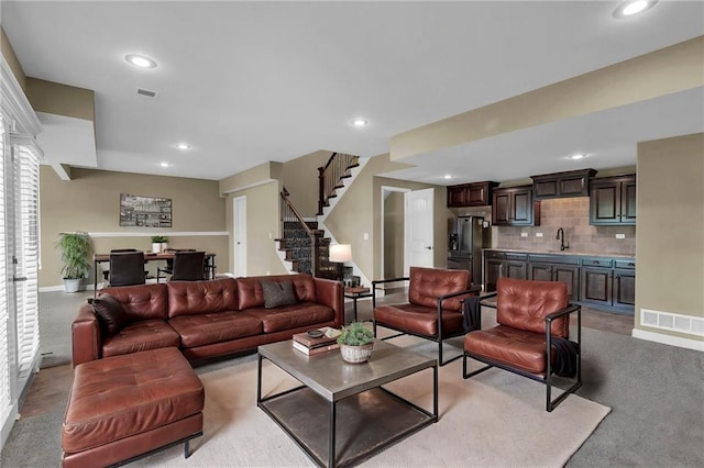 12750 N Arbor Way, Platte City, MO 64079 - living room featuring recessed lighting, stairway, baseboards, and light colored carpet