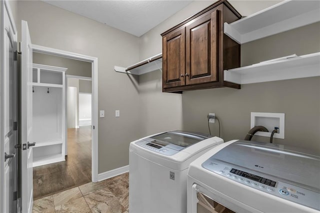 12750 N Arbor Way, Platte City, MO 64079 - washroom featuring washer and clothes dryer, cabinet space, and baseboards