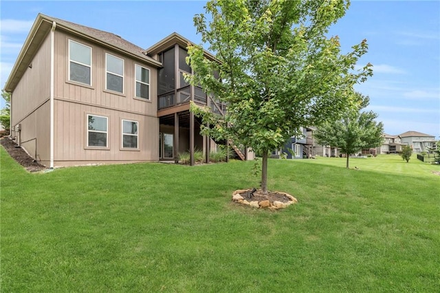 12750 N Arbor Way, Platte City, MO 64079 - back of property with a lawn and a wooden deck