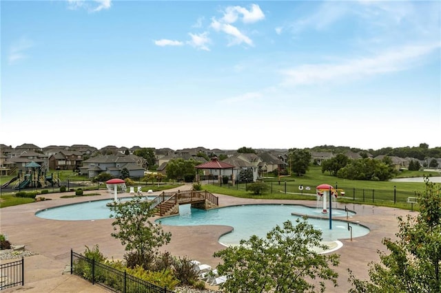 12750 N Arbor Way, Platte City, MO 64079 - community pool with a residential view, a gazebo, a water play area, and a patio