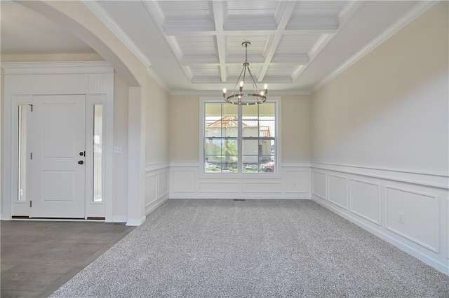 111 N Singletree St, Olathe, KS 66061 - entrance foyer featuring coffered ceiling, arched walkways, a chandelier, beam ceiling, and ornamental molding