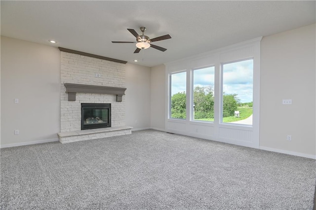 111 N Singletree St, Olathe, KS 66061 - unfurnished living room with ceiling fan, carpet, a brick fireplace, baseboards, and recessed lighting